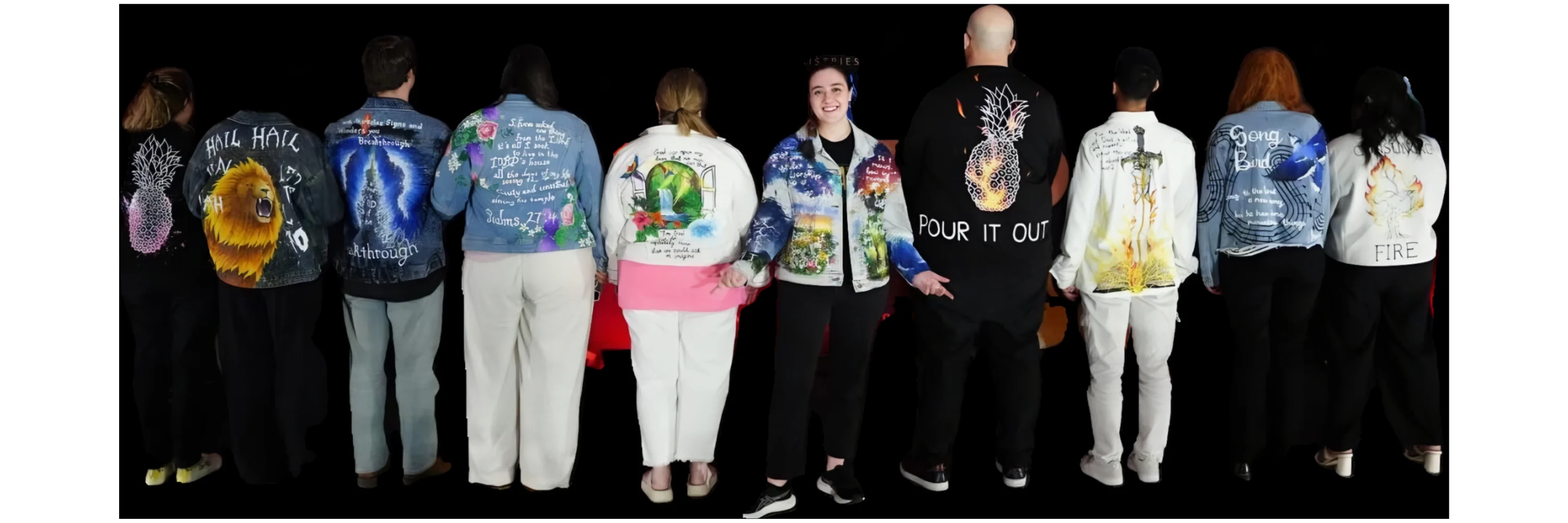 A group of people wearing Emily Holland's hand-painted jackets