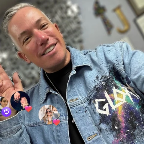 Joshua Mills wearing their hand-painted jacket